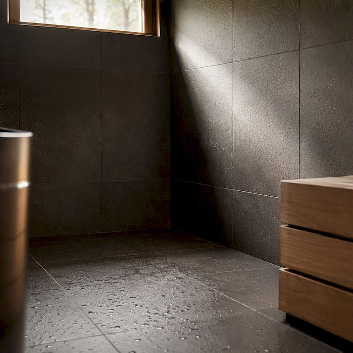 Tiled sauna floor and wall near heater