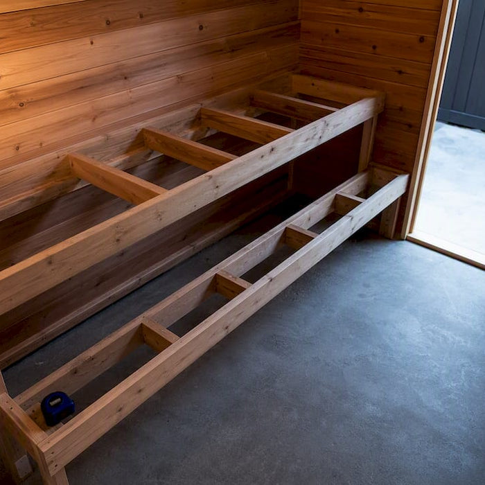 Unfinished sauna room with tiered bench layout