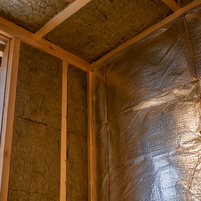 Mineral wool insulation in sauna wall assembly