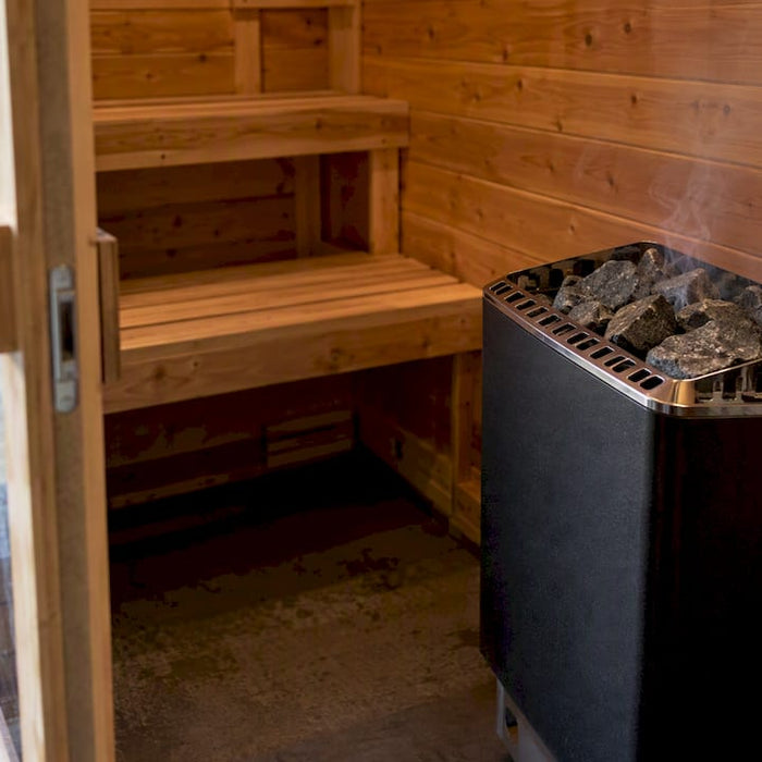 New sauna heater during first heating session