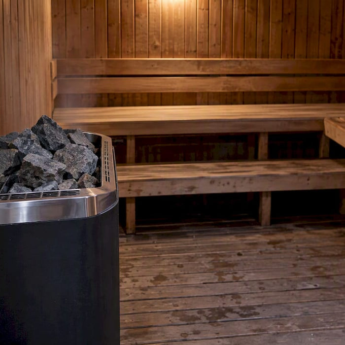 Electric sauna heater warming a sauna