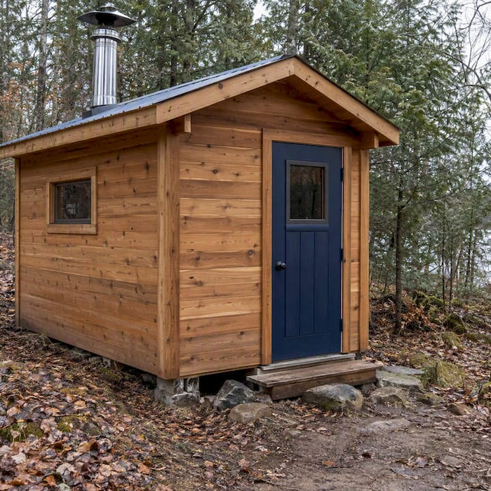 Off-grid cedar sauna with a metal chimney