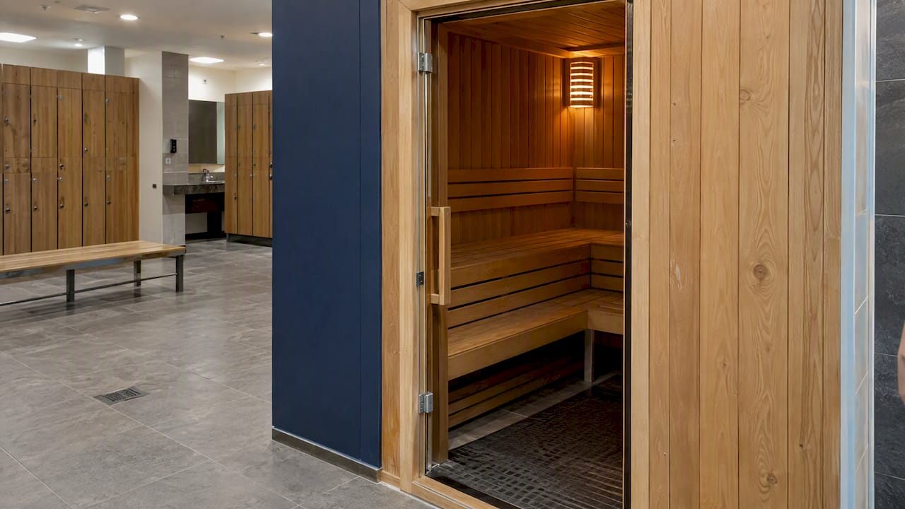 Locker room sauna doorway with timber benches