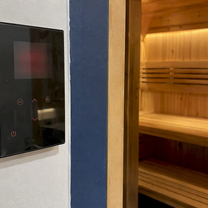 Harvia Xenio control beside sauna doorway